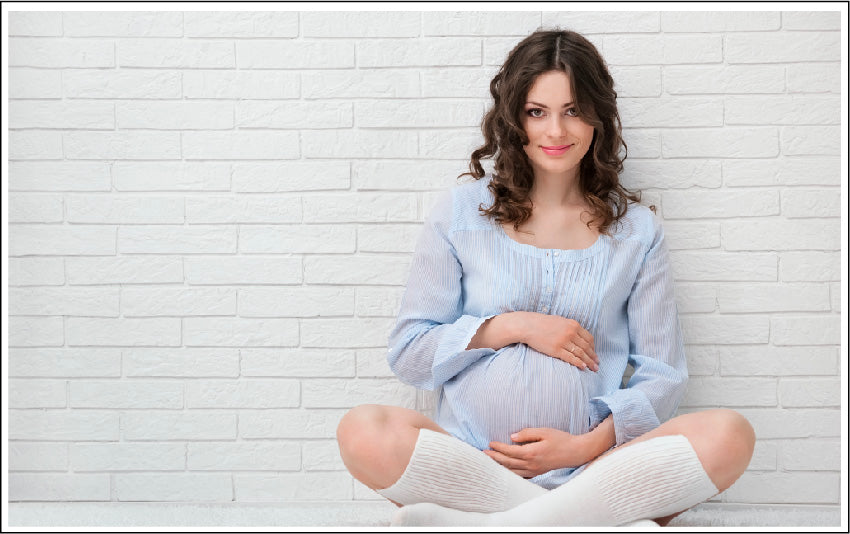 Pregnant Woman holding her belly with love