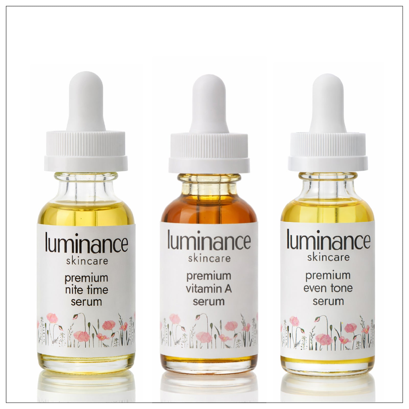 Three bottles of Luminance skincare serum on a white background